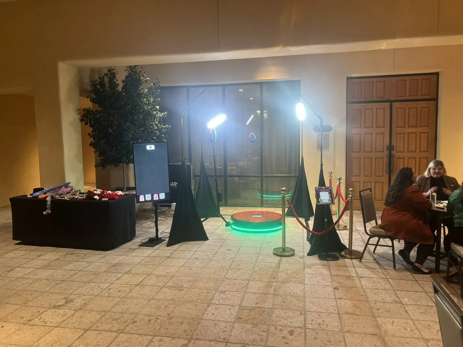 360 video booth set up in a hotel lobby for an evening event
